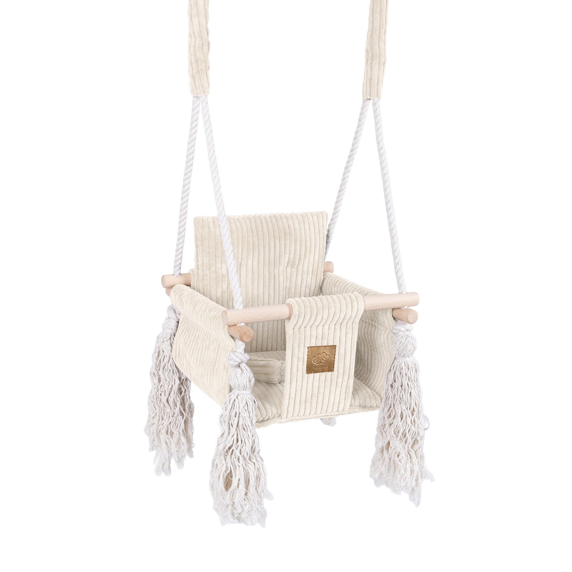 Children's swing with white ropes and fringes